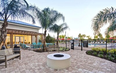 Outdoor terrace at Homewood Suites By Hilton Orlando Theme Parks.