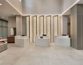 Reception desk at Embassy Suites By Hilton Atlanta Midtown.