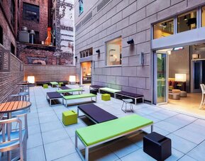 Terrace with natural light perfect for coworking at Aloft Manhattan Downtown - Financial District.
