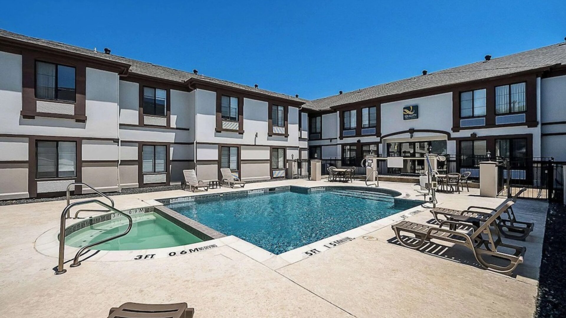 Outdoor pool at Quality Inn & Suites Irving DFW Airport South.