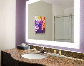 Guest bathroom at La Quinta Inn & Suites By Wyndham Lackawanna.