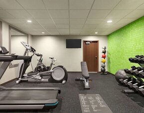 Fitness center at La Quinta Inn & Suites By Wyndham Lackawanna.