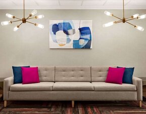 Lobby seating at La Quinta Inn & Suites By Wyndham Lackawanna.