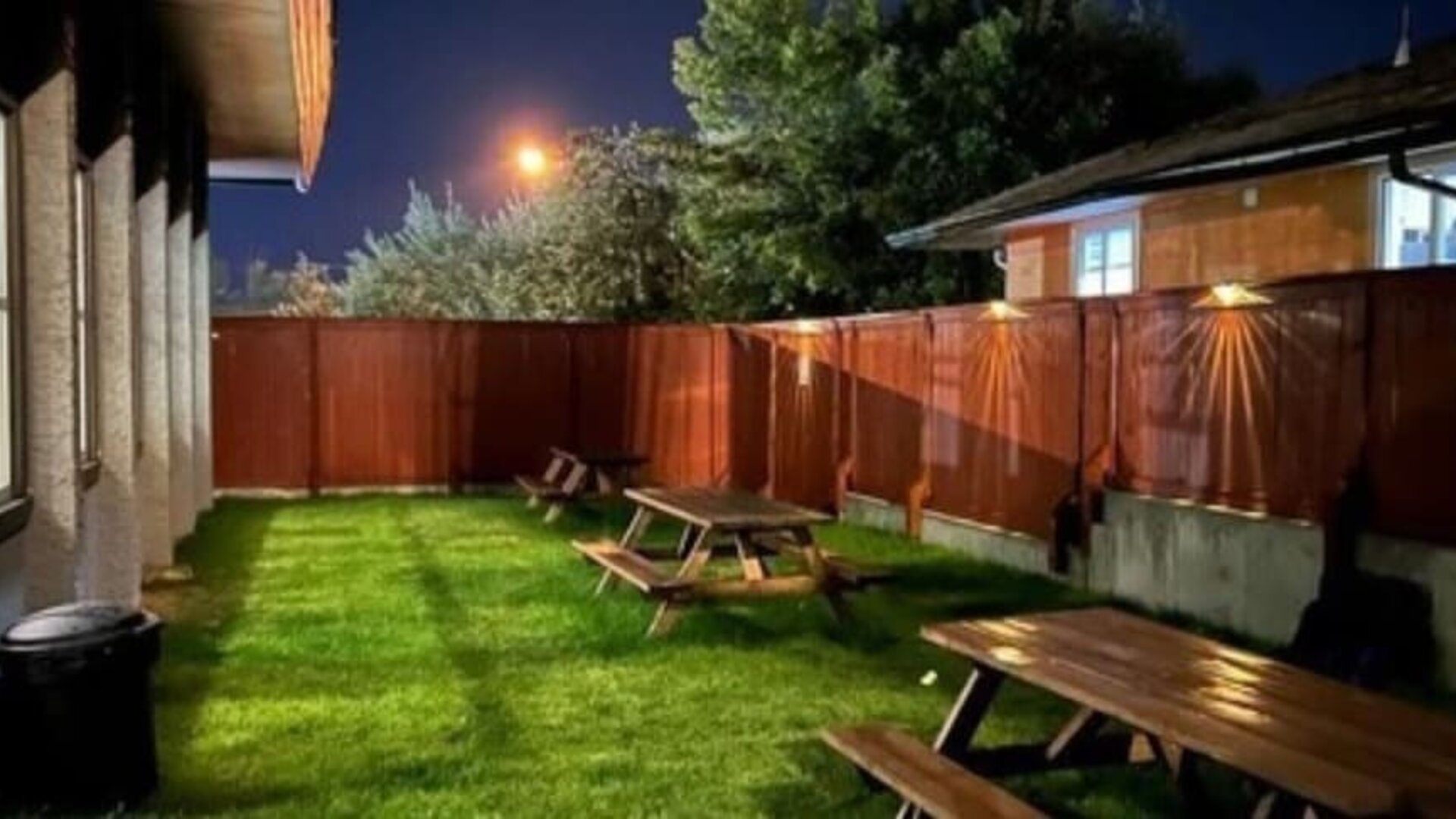 Outdoor terrace and garden at Quality Inn & Suites Vernon.
