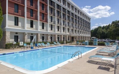 Outdoor pool at Holiday Inn Express Atlanta Airport - College Park By IHG.