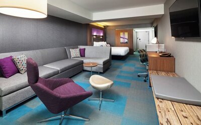 Day use room with living area and work desk at Aloft SFO.