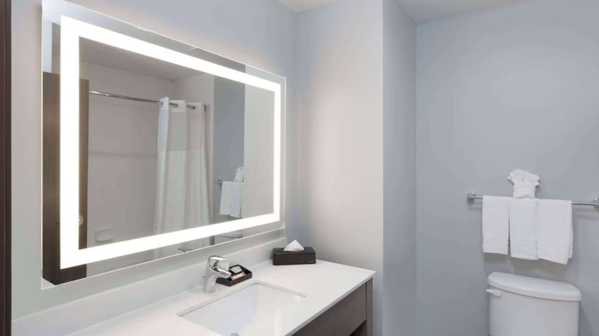 Guest bathroom at Days Inn & Suites By Wyndham Houston NW Cypress.