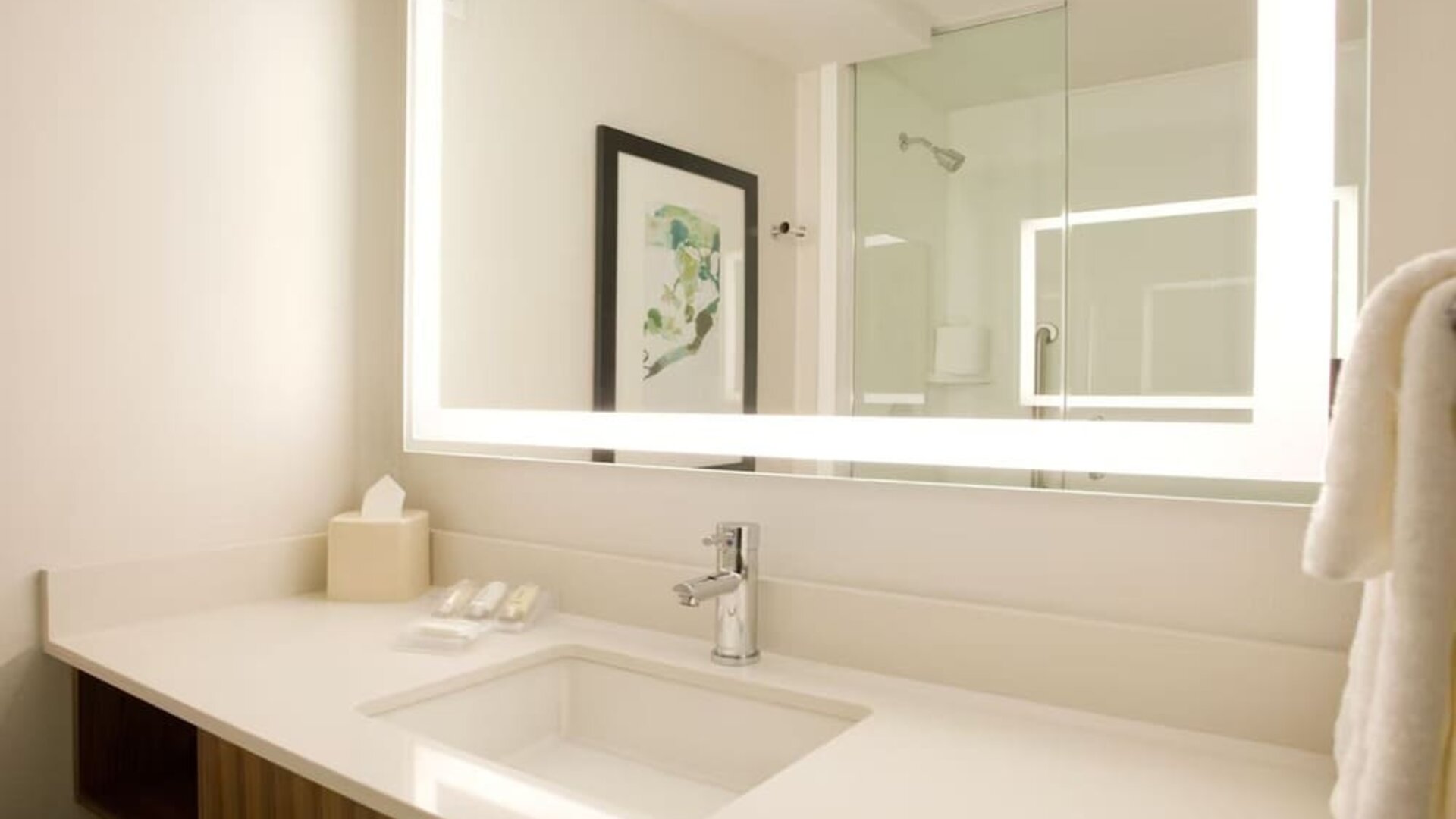 Guest bathroom with shower at Hilton Garden Inn New York Central Park South Mid-town West.