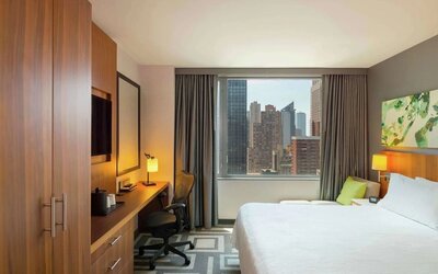 Day use room with work desk and natural light at Hilton Garden Inn New York Central Park South Mid-town West.