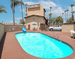 Outdoor pool at Hyland Inn Near Legoland.