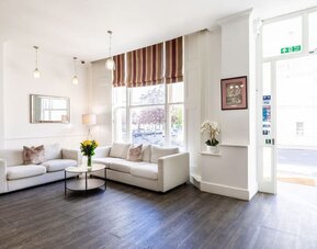 Lobby seating at The Chapter - Leisure Inn Hotel.