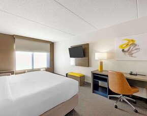 Work desk and TV inside day use room at Comfort Inn & Suites Arlington Heights - Schaumburg.