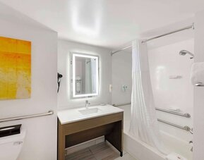 Private bathroom with tub at Comfort Inn & Suites Arlington Heights - Schaumburg.
