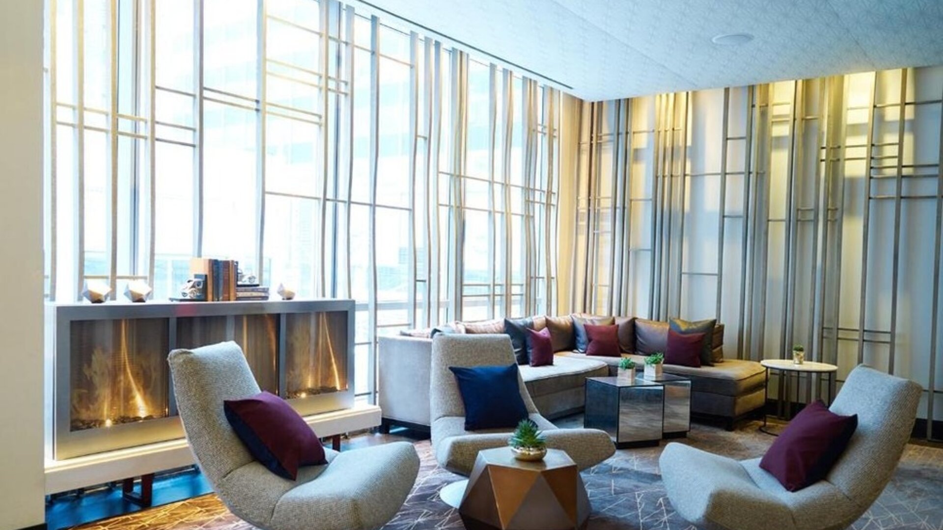 Lounge area with comfortable seating and fireplace at Hotel 48LEX New York.