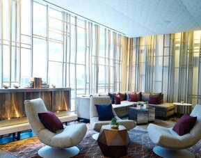 Lounge area with comfortable seating and fireplace at Hotel 48LEX New York.