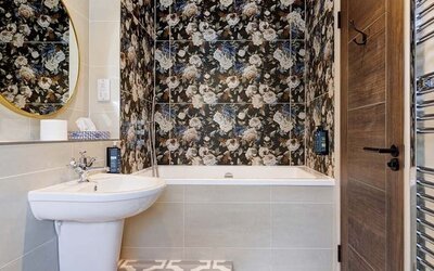 Bathroom at Thatcher's Hotel - Surya Hotels.