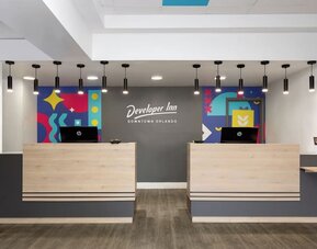 Reception desk at Developer Inn Downtown Orlando.