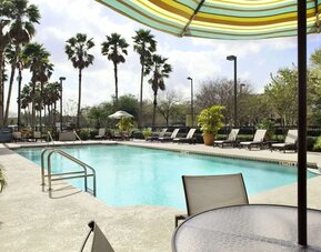 Outdoor pool at Embassy Suites By Hilton Orlando Airport.