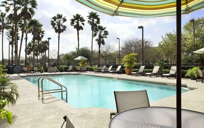Outdoor pool at Embassy Suites By Hilton Orlando Airport.