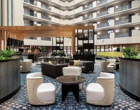 Lobby seating at Embassy Suites By Hilton Orlando Airport.