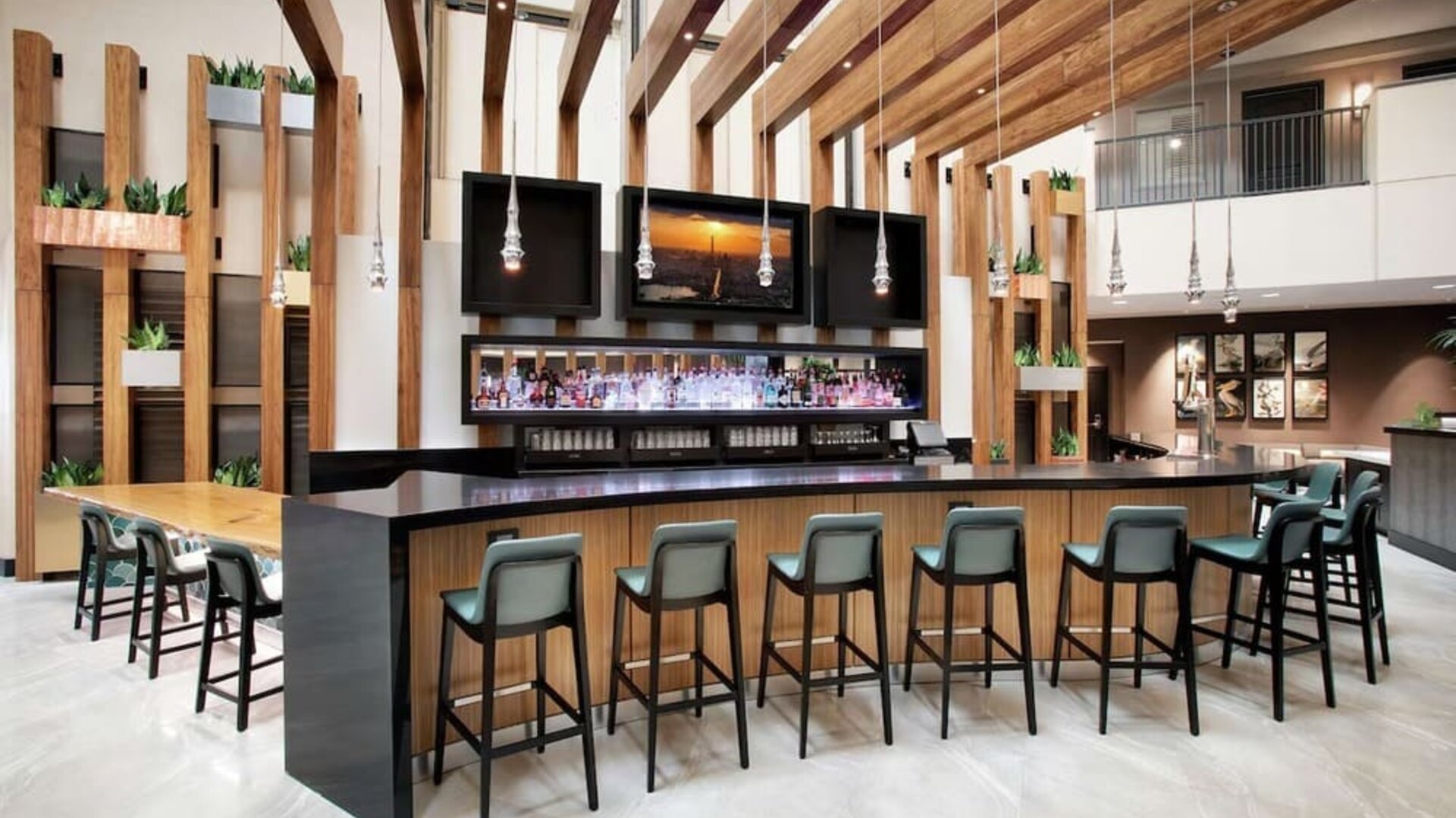 Hotel bar and lounge at Embassy Suites By Hilton Orlando Airport.