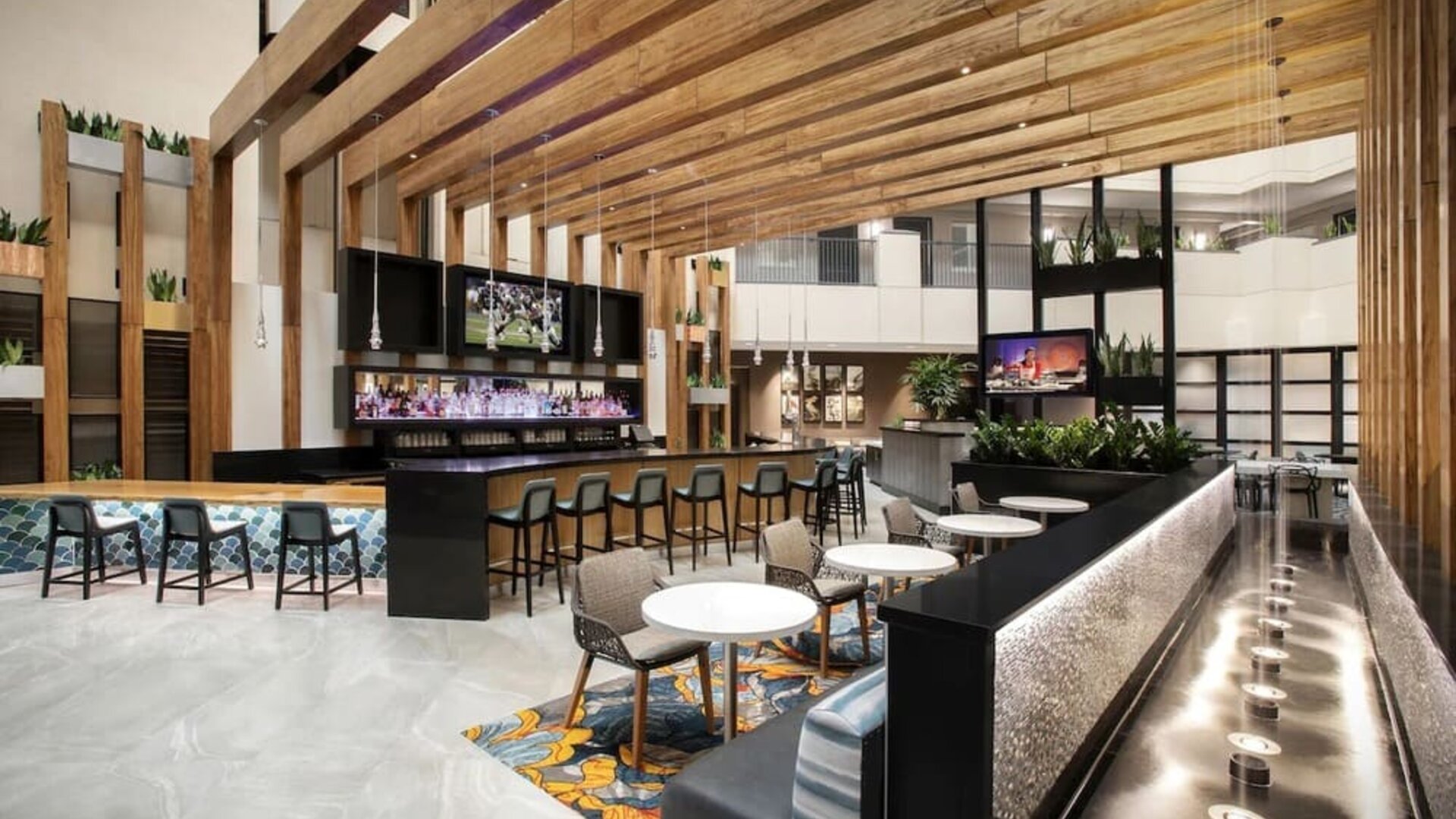 Hotel bar and lounge at Embassy Suites By Hilton Orlando Airport.
