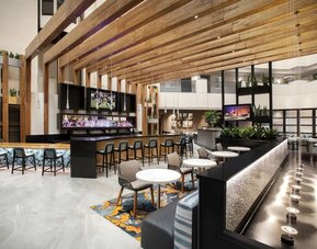 Hotel bar and lounge at Embassy Suites By Hilton Orlando Airport.