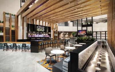 Hotel bar and lounge at Embassy Suites By Hilton Orlando Airport.