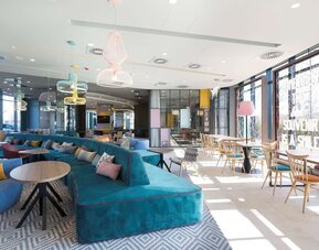 Lobby and lounge at Hampton By Hilton Krakow Airport.