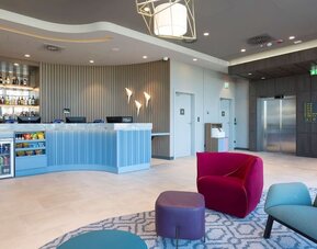 Lobby and lounge at Hampton By Hilton Krakow Airport.