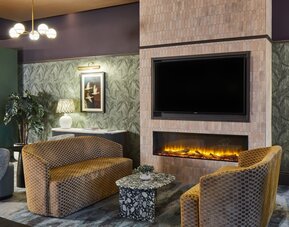 Lobby and fireplace at Leonardo Hotel Dublin Parnell Street.