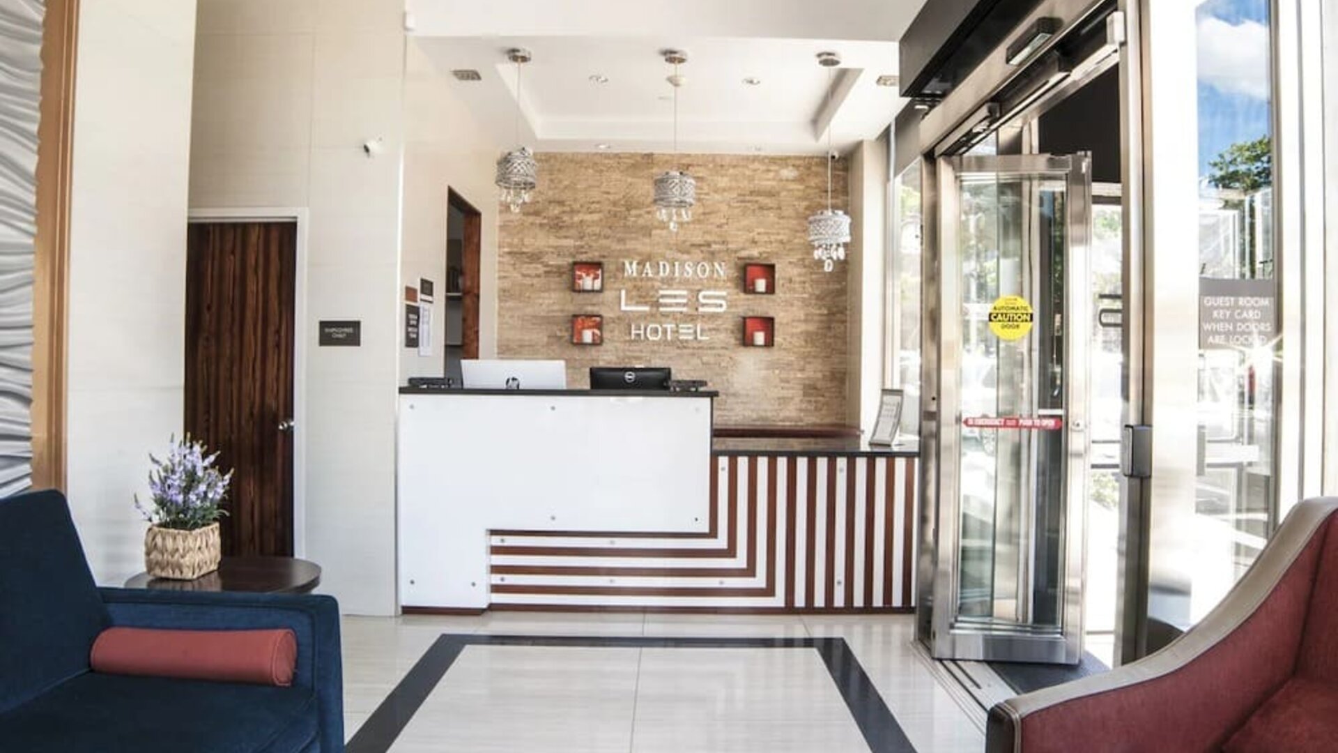 Reception area at Madison LES Hotel welcoming guests.
