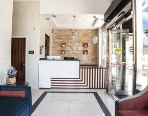 Reception area at Madison LES Hotel welcoming guests.