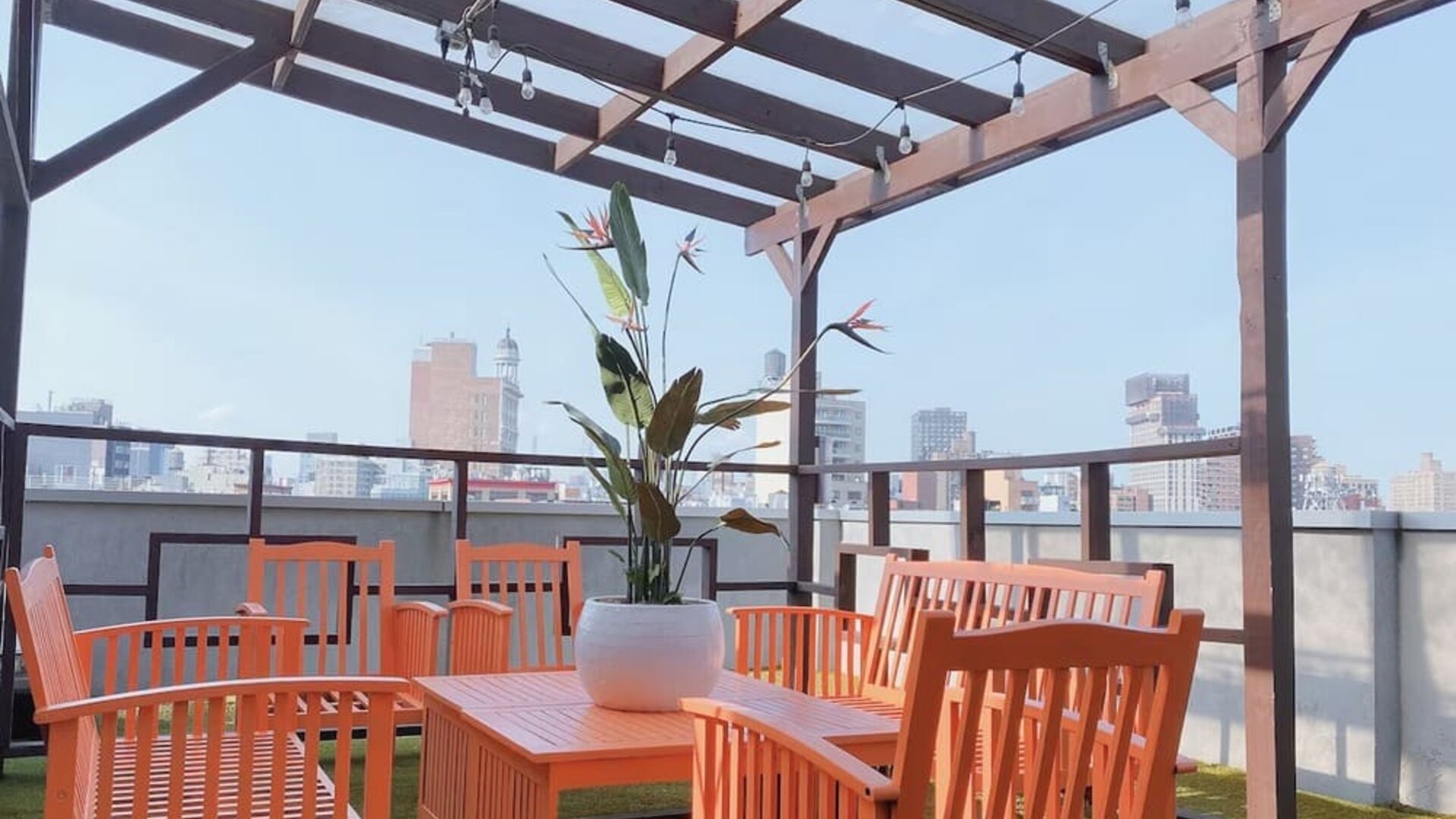 Outdoor terrace with table and chairs for relaxing/socializing.
