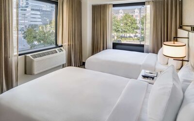 Comfortable day room at DoubleTree By Hilton Jersey City with natural light and beautiful views.