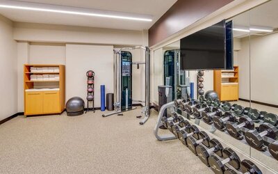 Fully equipped fitness center at DoubleTree by Hilton Hotel & Suites Jersey City.
