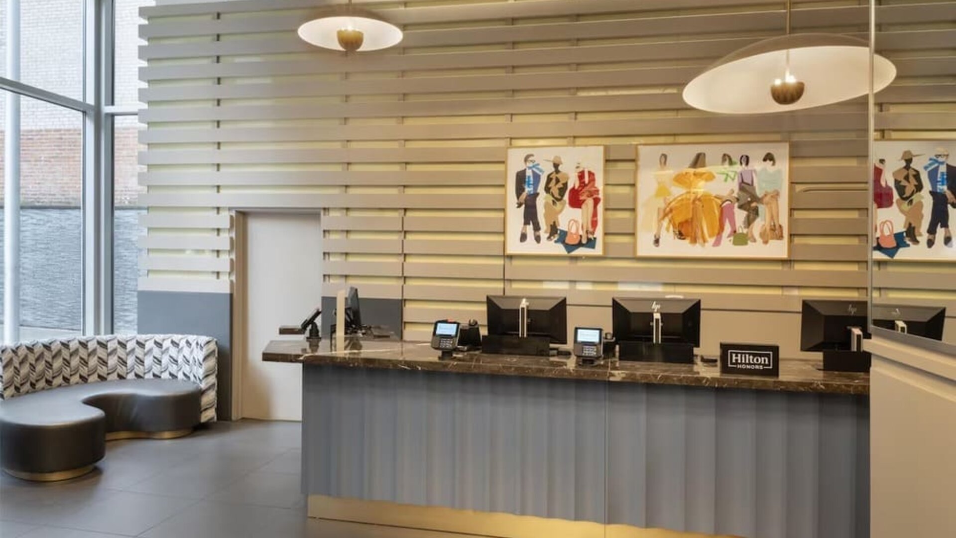 Reception area with comfortable seating at the Hilton Fashion District. 