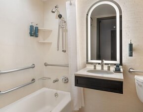 Modern, fully equipped bathroom at Hilton Fashion District.