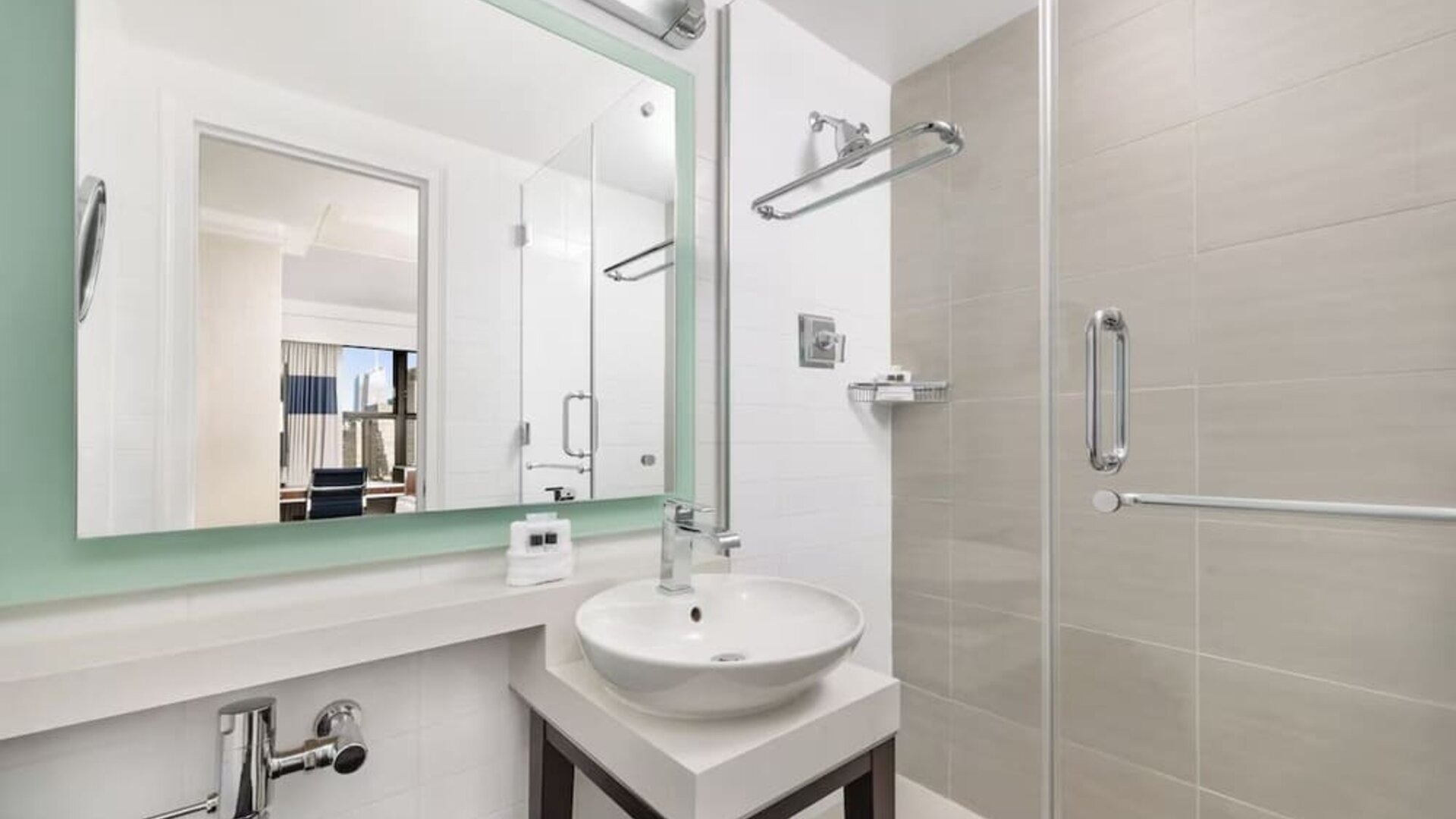 Modern bathroom with plush towels at New Yorker by Lotte Hotels