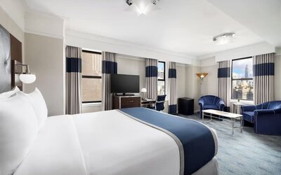 Day use room with work desk and natural light at New Yorker by Lotte Hotels.