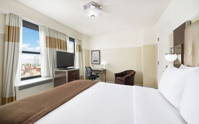 Day use room with work desk and natural light at New Yorker by Lotte Hotels.