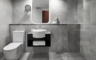 Guest bathroom with shower at Crowne Plaza Sydney Airport.