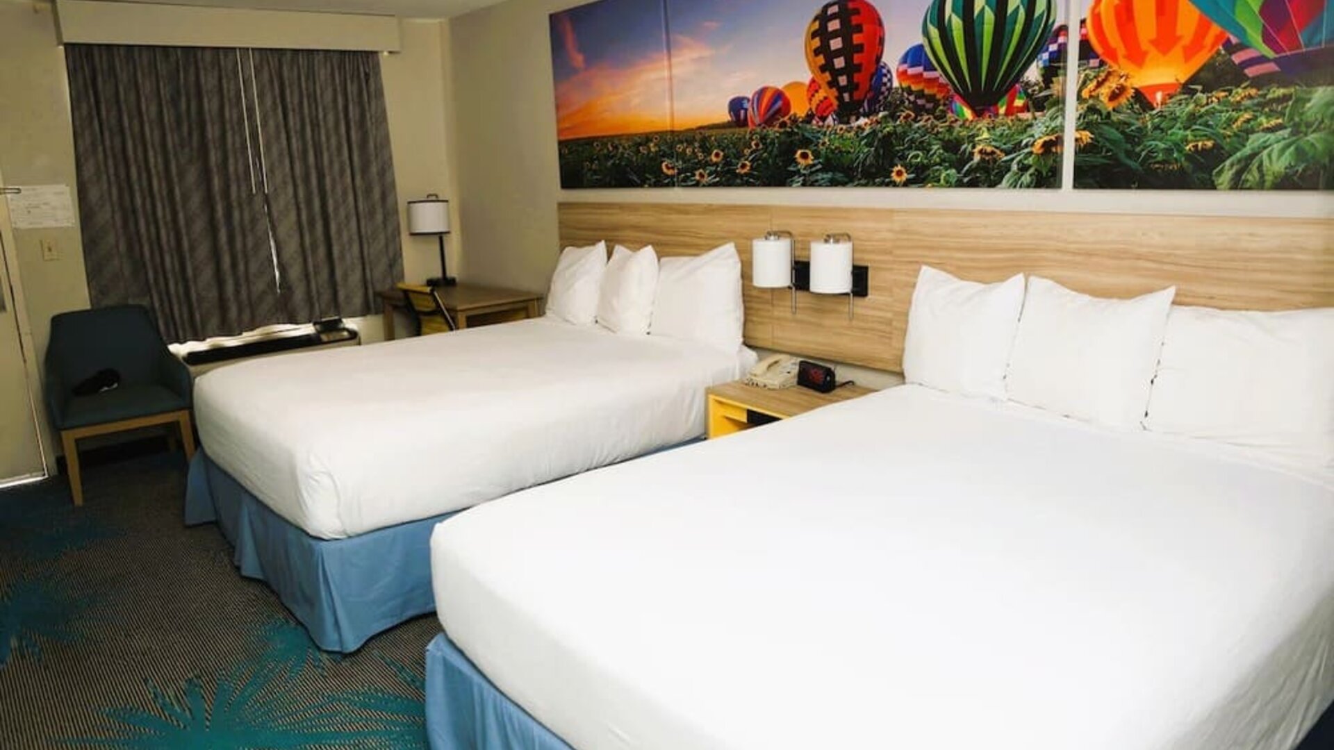 Day room with work desk at Days Inn By Wyndham East Albuquerque.