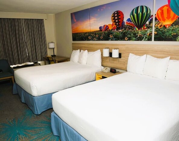 Day room with work desk at Days Inn By Wyndham East Albuquerque.