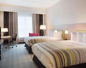 Day room with natural light and work space at Country Inn & Suites By Radisson, Katy - Houston West.