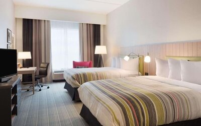 Day room with natural light and work space at Country Inn & Suites By Radisson, Katy - Houston West.