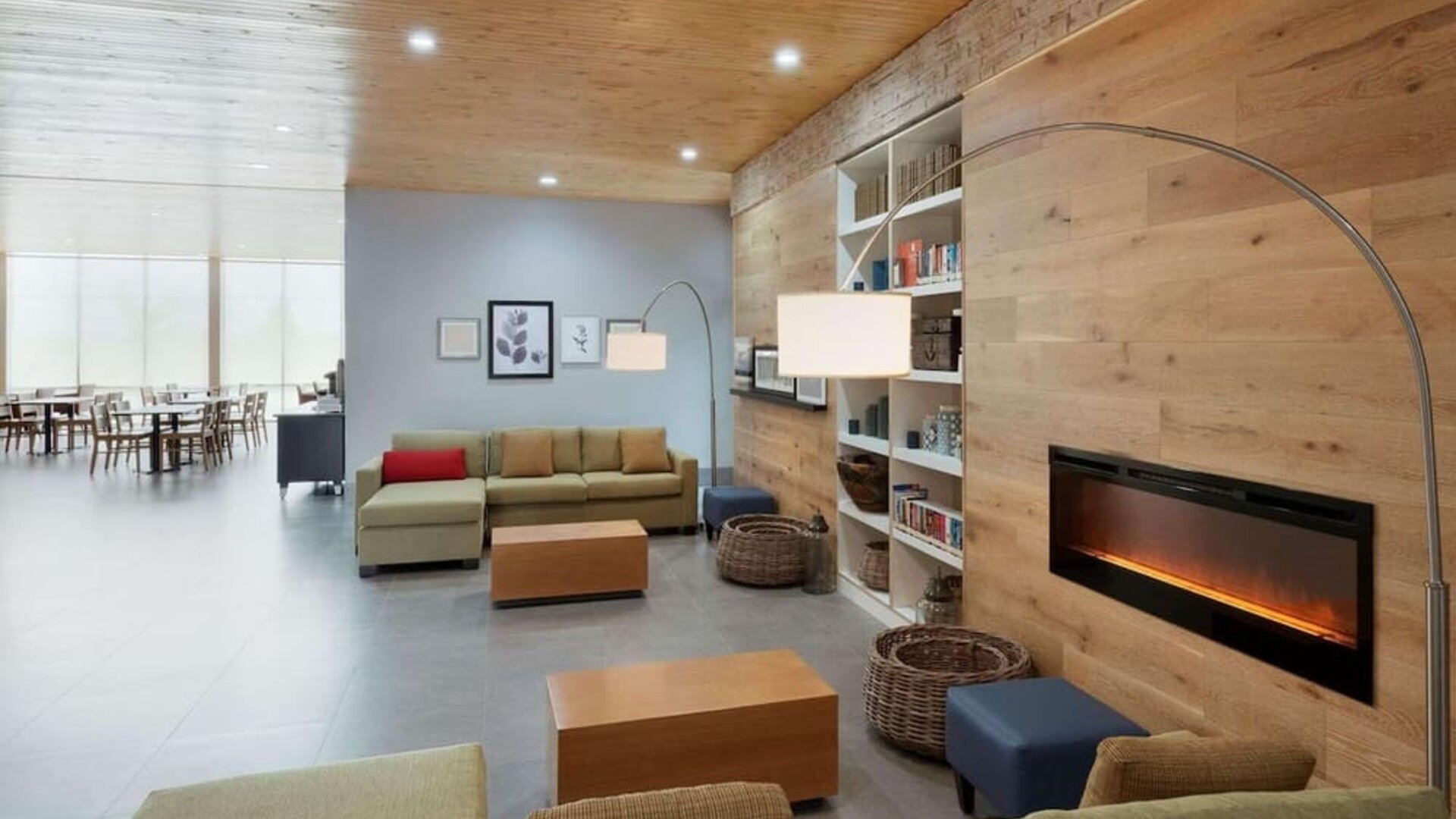 Lobby with a cozy fireplace and comfortable seating at Country Inn & Suites By Radisson, Katy - Houston West.