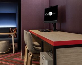 Business center with PC and desk at Tru By Hilton Montreal Centre-Ville.