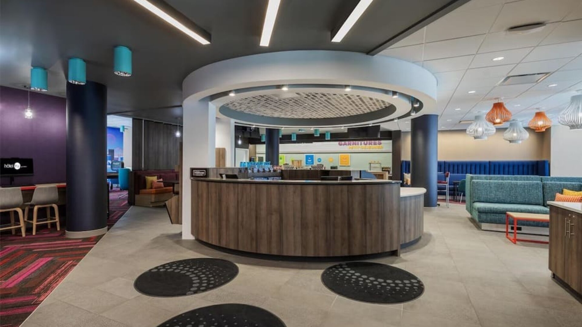 Hotel reception desk at Tru By Hilton Montreal Centre-Ville.