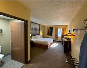 Day room with a desk and chair at Coratel Inn And Suites By Jasper Wichita North